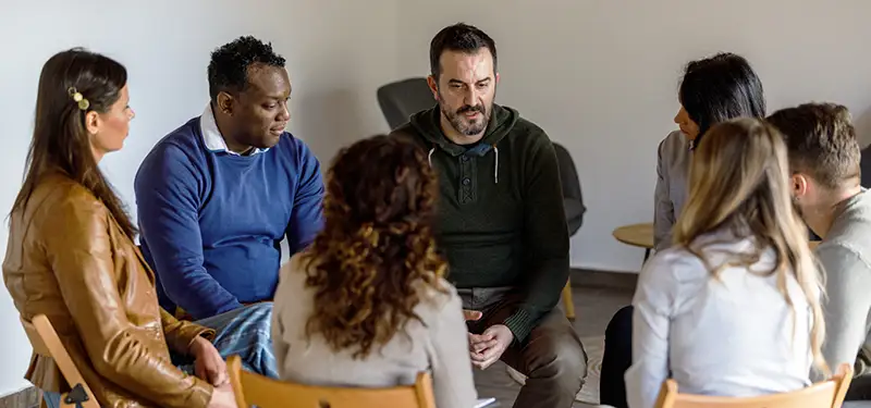 Trauma Solutions: Group discussion highlighting the role of connection, community, and supportive relationships in addiction recovery.