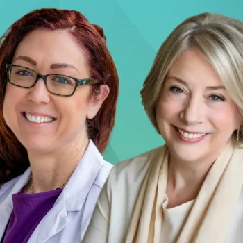Trauma Solutions: Two women smiling at the camera; one wears glasses and a white coat, the other has blonde hair and a beige scarf, against a teal background.