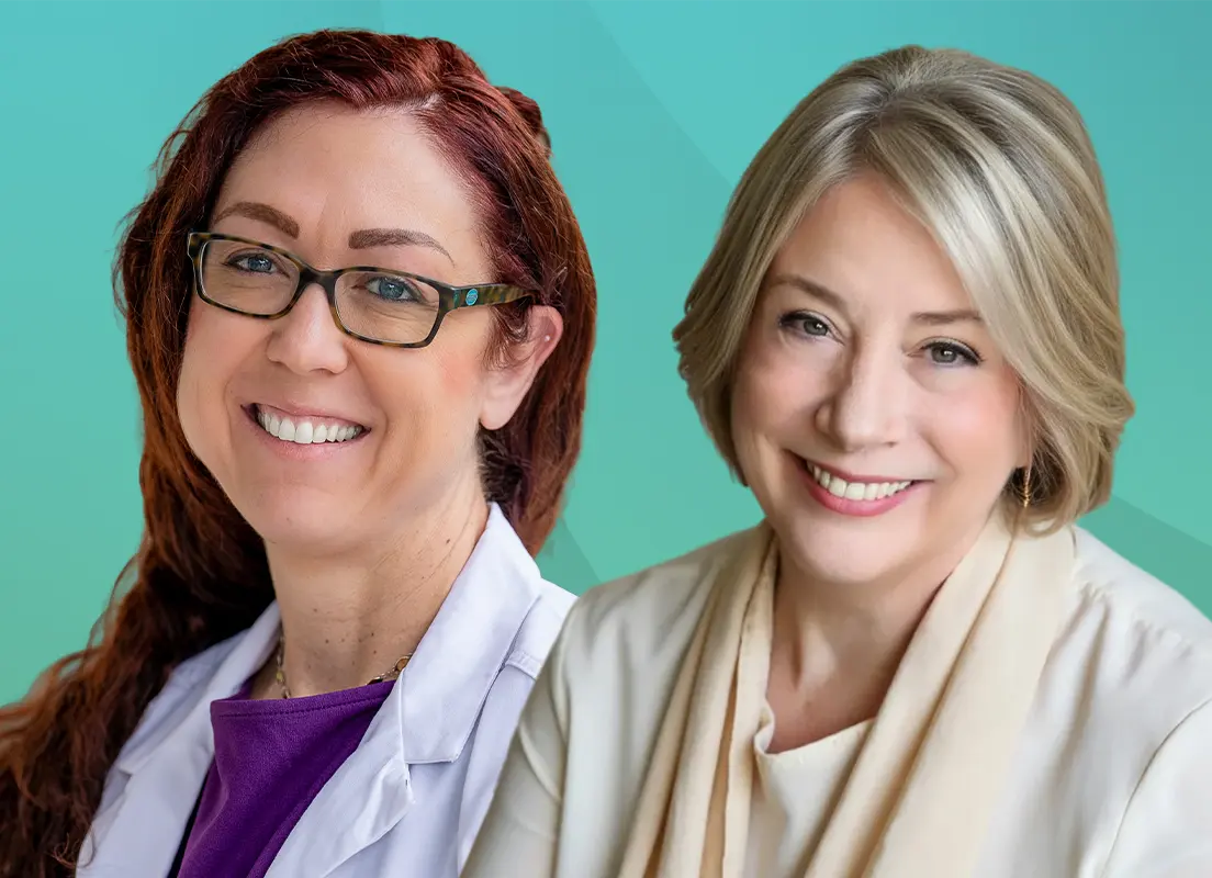 Trauma Solutions: Two women smiling at the camera; one wears glasses and a white coat, the other has blonde hair and a beige scarf, against a teal background.