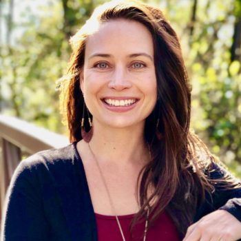 April Eichhorn standing on a bridge.