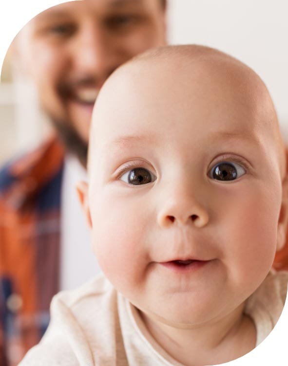 A baby's smile at a man reflects their attachment style.