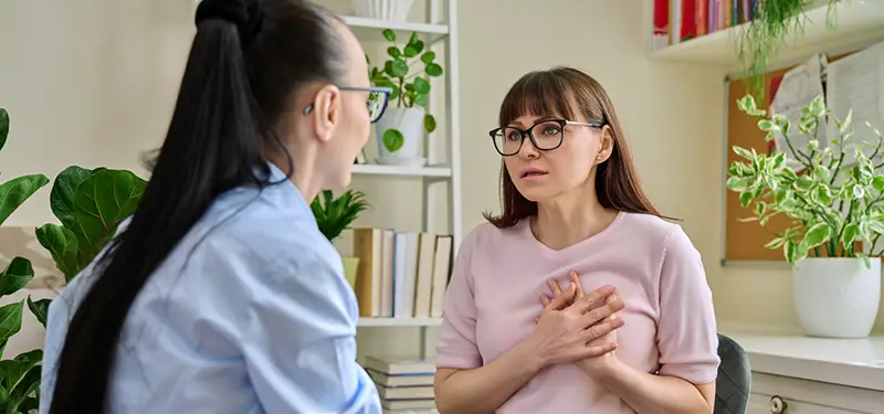 A moment of compassion and understanding between a therapist and client, celebrating the strengths and healing the burdens left by parentification.
