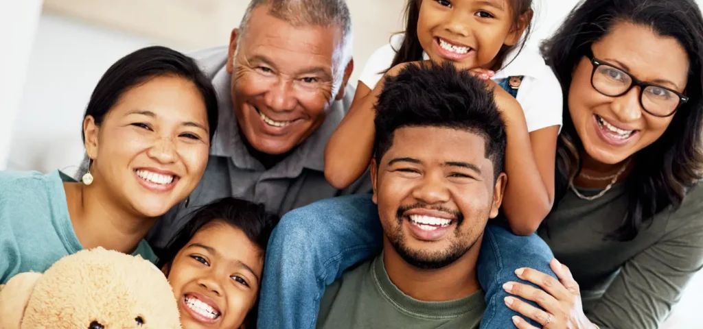 A happy intergenerational family portrait, demonstrating the clear flow of love and protection from one generation to the next.