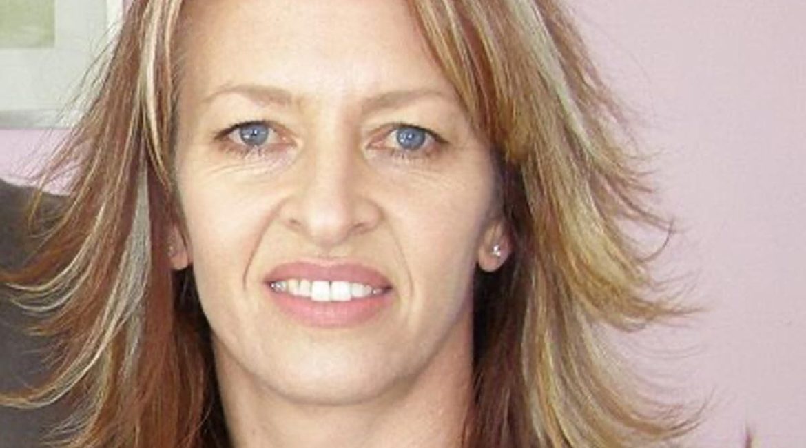A woman wearing a black shirt.