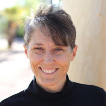 Michelle Gallagher wearing a black turtle neck shirt.