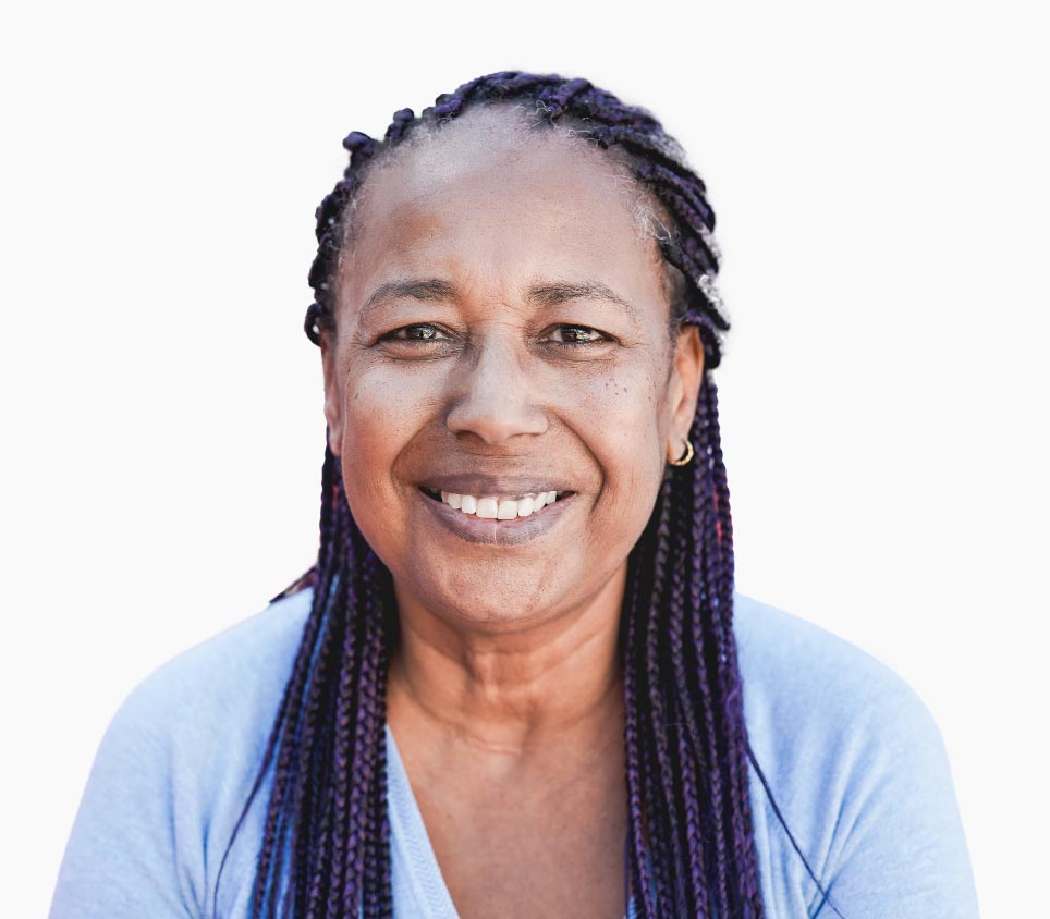 An african-american woman with purple dreadlocks smiling.
