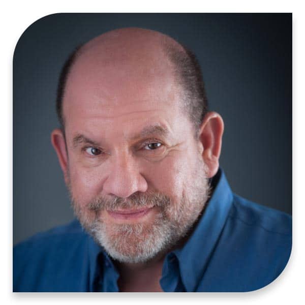 A bearded man in a blue shirt.