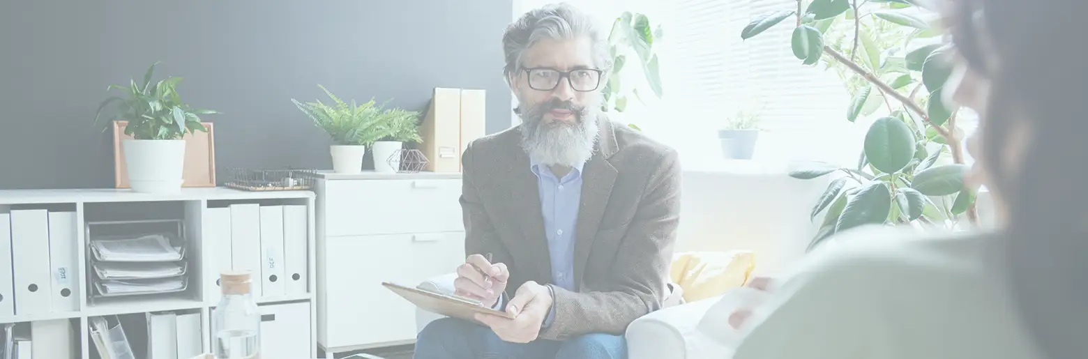 Trauma Solutions: An experienced therapist works with a client in his office. Taking an integrative approach to working with trauma allows for flexibility and responsiveness to a client’s needs